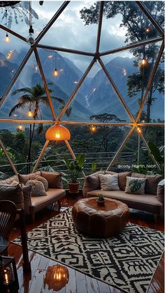 a living room filled with lots of furniture and lights on top of a wooden floor