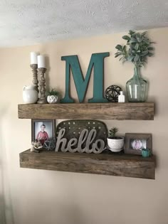 two wooden shelves with letters and pictures on them, one has a monogrammed letter