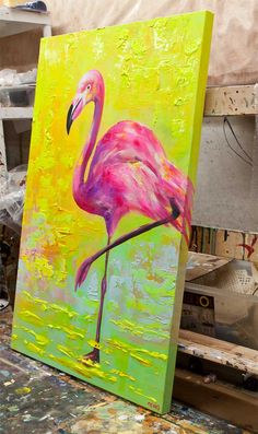 a painting of a pink flamingo on an easel