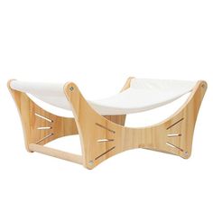 a wooden chair with white fabric on it's back and seat cushion in the shape of a boat