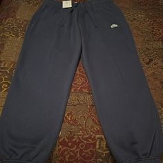 New! Mens Nike Sportswear Fleece Lined Elastic Ankle Sweatpants. Navy Color Way. Mens Size Xl Waist 17 Inseam 29.75. Drawstring Waist And Two Hand Pockets. Pristine Condition. See All Photos Navy Sporty Joggers For Loungewear, Sporty Navy Joggers For Loungewear, Nike Blue Relaxed Fit Sweatpants, Comfortable Nike Pants With Pockets, Comfortable Blue Sports Sweats, Comfortable Blue Sweats For Sports, Nike Blue Sweats For Loungewear, Casual Blue Nike Sweats, Casual Navy Sweatpants For Jogging