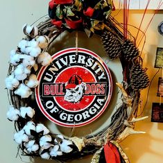 a wreath with the university of georgia logo on it and some cotton balls around it