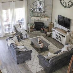 a living room filled with furniture and a flat screen tv