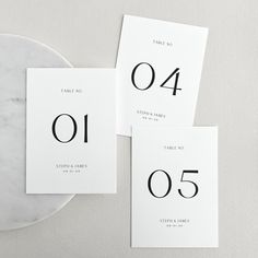 the table numbers are laid out on top of each other, and ready to be used as place cards