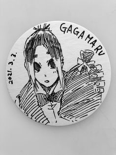 a white button with a drawing of a girl on it