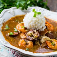 a white bowl filled with shrimp and rice