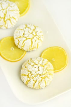 three lemon cookies with powdered sugar on top