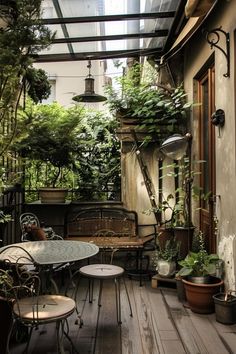 an outdoor patio with potted plants and tables