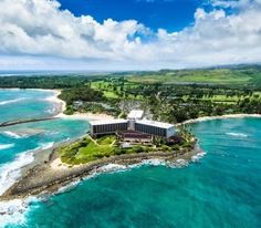 an aerial view of the resort and ocean