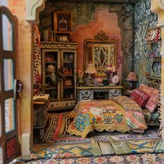 a doll house with furniture and accessories in the room, including a bed that is made out of fabric