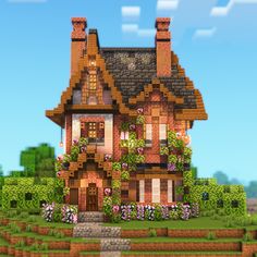 a house in the middle of some flowers