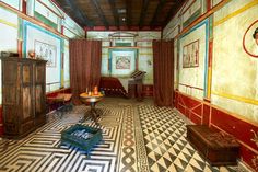 the room is decorated in an art deco style with colorful walls and flooring, along with antique furniture