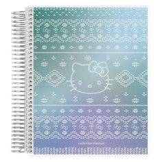 a spiral notebook with an image of a hello kitty on it