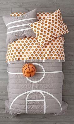 a basketball themed bedding set with orange and white polka dots