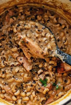 a large pot filled with beans and meat