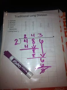 a piece of paper with writing on it and a marker next to it that says, traditional long division