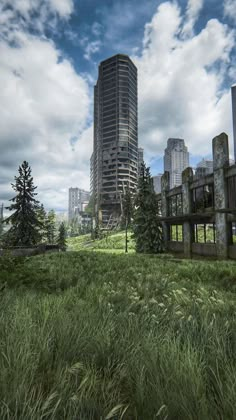 an abandoned building in the middle of a grassy area with trees and buildings behind it