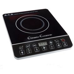 a black and white stove top with the words classic cuisine on it's side