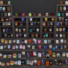 a book shelf filled with lots of books on top of each other in front of a black wall