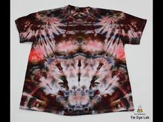 a tie dye t - shirt with an abstract design