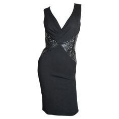 A stunning black jersey dress from Versace. It is sleeveless, fitted with a V front neckline and 2 triangular insets at the front and back waist of intricately laser cut black patent leather in a series of perforations in varying sizes and shapes. The skirt portion is straight to the hem and the dress has a back zipper. Fits sizes Extra Small, Small. Marked Italian size 38. Bust 33-35" Waist 28" Hips 35-38" Length 37.50" Black Jersey Dress, Dior Clothing, Skirt Draping, Black Silk Dress, Black Jersey, Draped Dress, Silk Skirt, Day Dress, Waist Dress