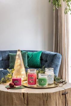 candles on a table in front of a couch