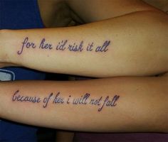 two people with tattoos that say for her and him, it is all because they are not