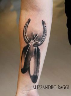 a black and white photo of a tattoo with an arrow on the side of it