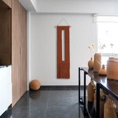 an empty room with vases on the counter