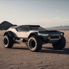 a futuristic vehicle is parked in the desert