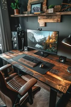 a desk with a computer and speakers on it