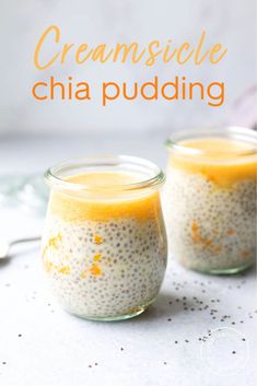 two jars filled with chia pudding on top of a table