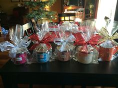 several wrapped gifts sitting on top of a table