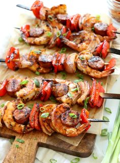 grilled shrimp and vegetable skewers on a cutting board