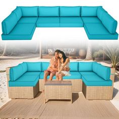 two women sitting on top of a blue couch in front of a sandy beach area