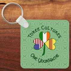 a square keychain with the words three cultures one gourmet on it