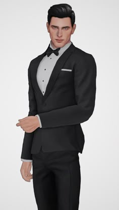 a man in a tuxedo poses for the camera