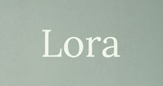 the word lora written in white on a gray wall