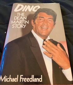 a book about the dean martin story on a bed