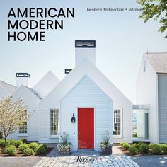 an american modern home magazine cover with a red door and white houses in the background