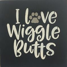 i love wiggle butts sign with a paw on it