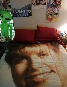 a bed with an image of a man's face on it