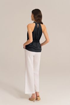 Add a touch of edgy sophistication to your wardrobe with this halterneck tops. The cut-out shoulder design and the keyhole back adds a touch of elegance and trendy. The elastic waist ensures a comfortable and flattering fit. Perfect for both casual and dressy occasions, these tops will elevate your style.Material : 98%Polyester+2%ViscoseElasticity : NoneSku : CLD027S24*Package : 1*TopsCare instructions:Do Not Bleach.Separate dark colors.Iron Low Heat. Elegant Stretch Halter Neck Tank Top, Elegant Halter Neck Top For Evening, Chic Stretch Halter Top Sleeveless, Chic Stretch Halter Top, Chic Halter Neck Blouse For Night Out, Versatile Halter Neck Top For Evening, Elegant Black High Neck Halter Top, Chic Sleeveless Blouse For Evening, Chic Evening Sleeveless Blouse