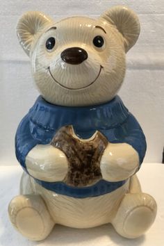 a ceramic bear figurine sitting on top of a table