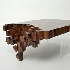 a table made out of wooden blocks on top of a white surface with an acrylic base