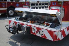 a red and white fire truck parked in a parking lot