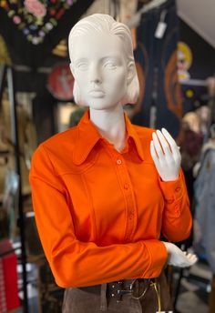 Vintage 60,s Orange Body Shirt ! What a Superb colour , so Sixties ! And This Beauty is in As New Condition ! Never Worn !...Label intact $16 from Myers! Brand Aywon old 18( mod. 14)...polyester. Bust 100cm,  Hip 105cm.,..waist80cm. Shoulder to shoulder 86.5cm ,sleeve 62cm Check out vest $120,.. Dog Ear Collar Fitted Long Sleeve Orange Shirt, Fitted Orange Long Sleeve Shirt, Orange Fitted Collared Shirt, Classic Fitted Orange Shirt, Fitted Orange Collared Shirt, Fitted Collared Orange Shirt, Classic Orange Tops For Fall, Classic Orange Top For Fall, Retro Solid Color Tops For Workwear