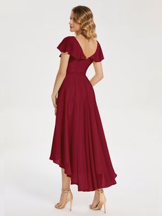 a woman in a red dress is looking back