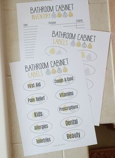 three bathroom cabinet labels on top of each other