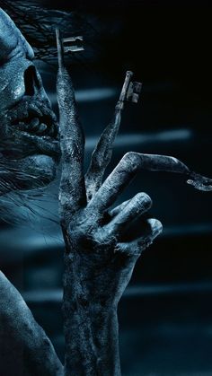 a zombie hand reaching out to grab something from the ground with it's fingers